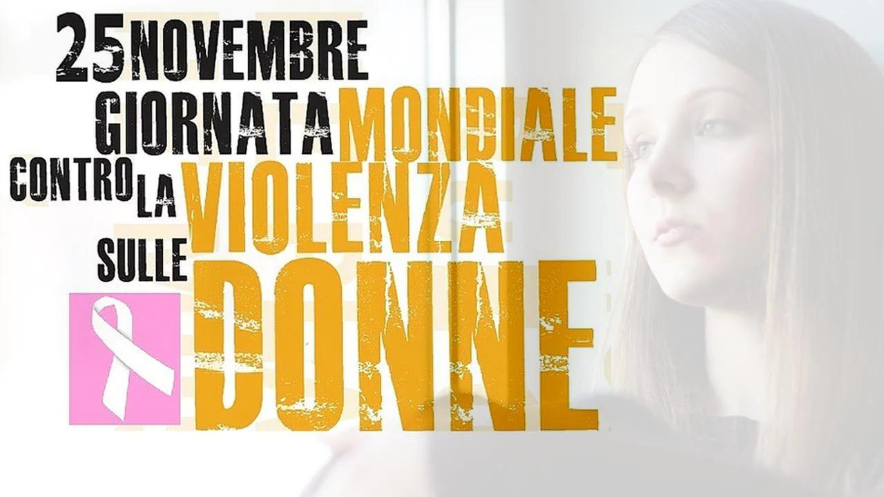 scritta "25 novembre giornata mondiale contro la violenza sulle donne" con viso di donna sullo sfondo